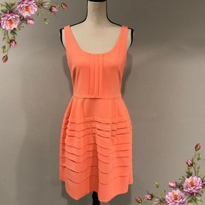 Salmon color midi dress.